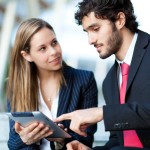 Portrait of two business people at work